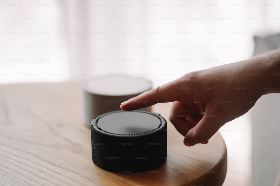 Smart speaker microphone mute button close up showing physical privacy switch