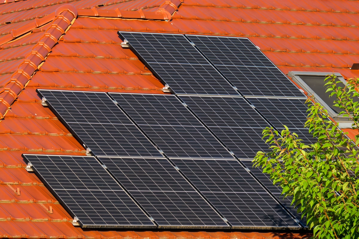 Solar panels on residential roof with home energy monitoring system