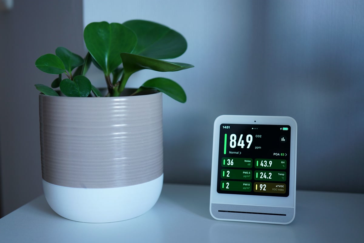 Smart air purifier in clean modern bedroom for allergy relief