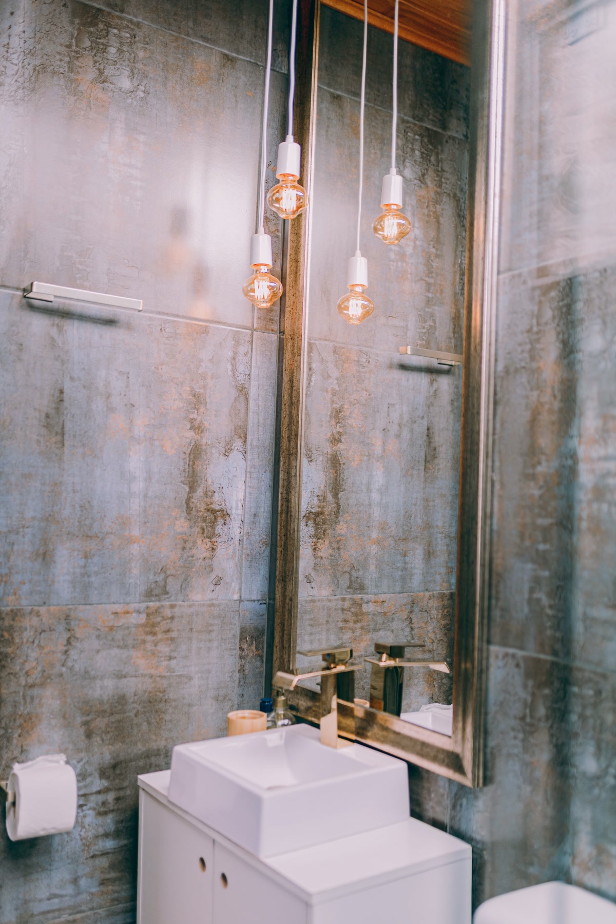 Modern bathroom with vanity light fixtures providing adjustable lighting for morning and nighttime routines