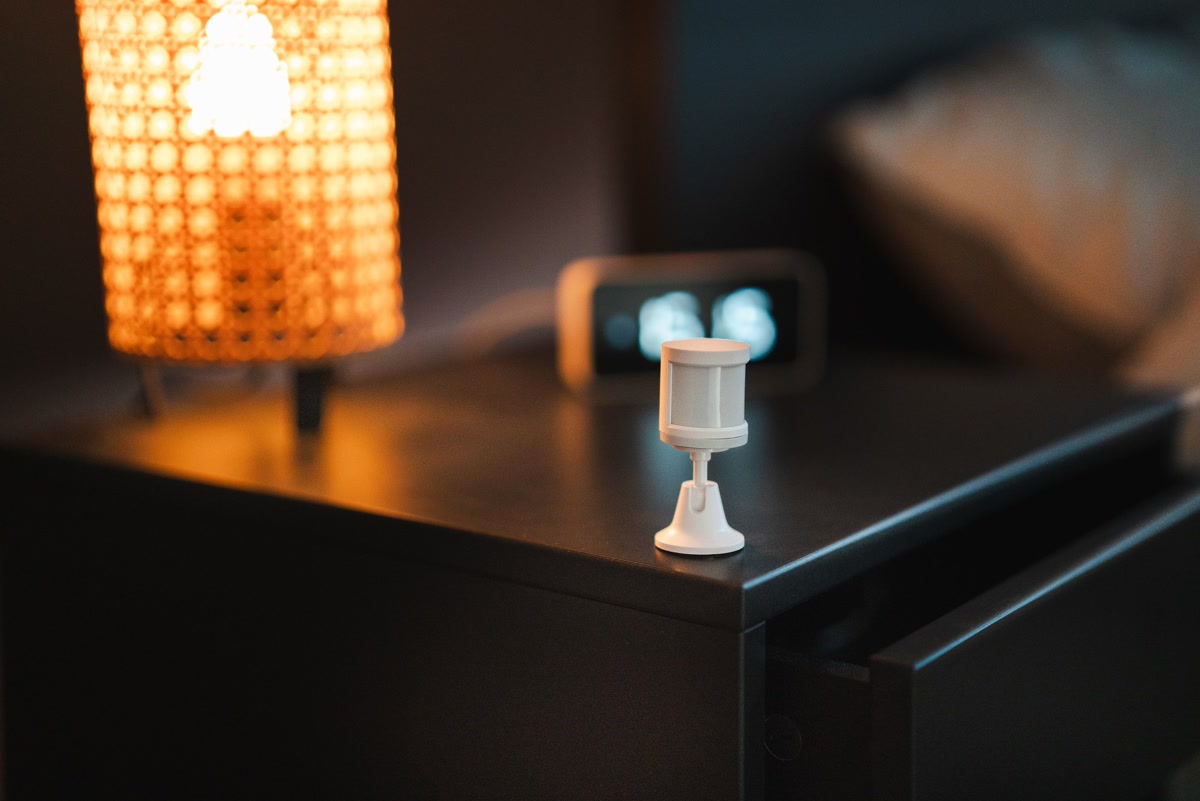 Smart home motion sensor mounted on wall for security and automation