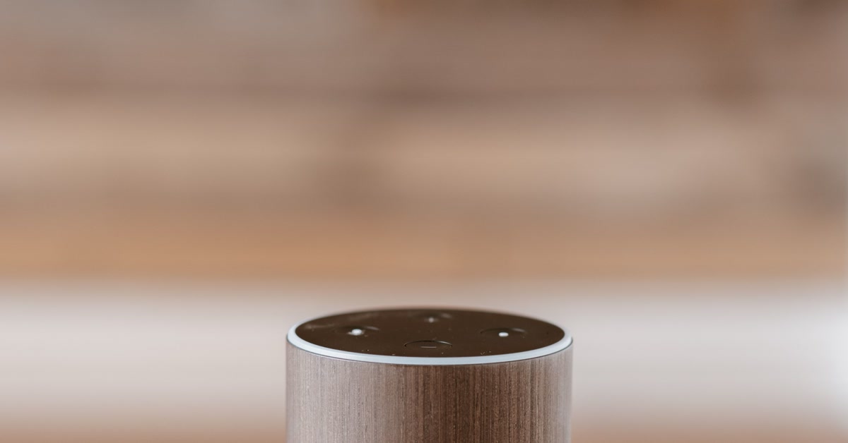 Amazon Echo smart speaker on bedside table