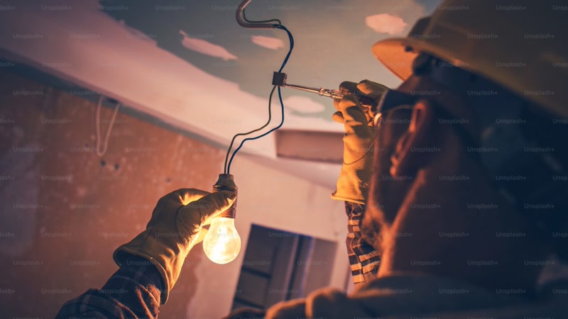 Smart bulb being installed in lamp