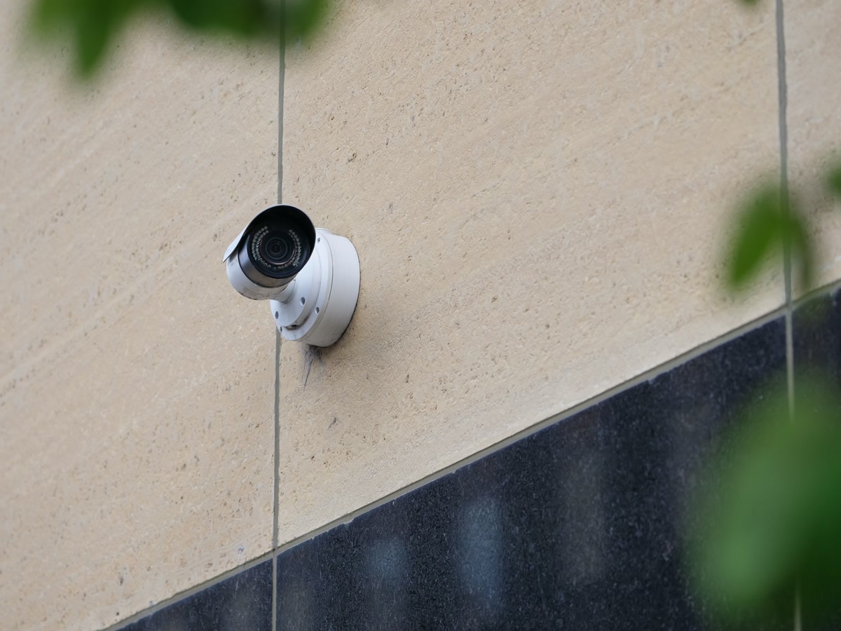 Smart outdoor security camera mounted in backyard
