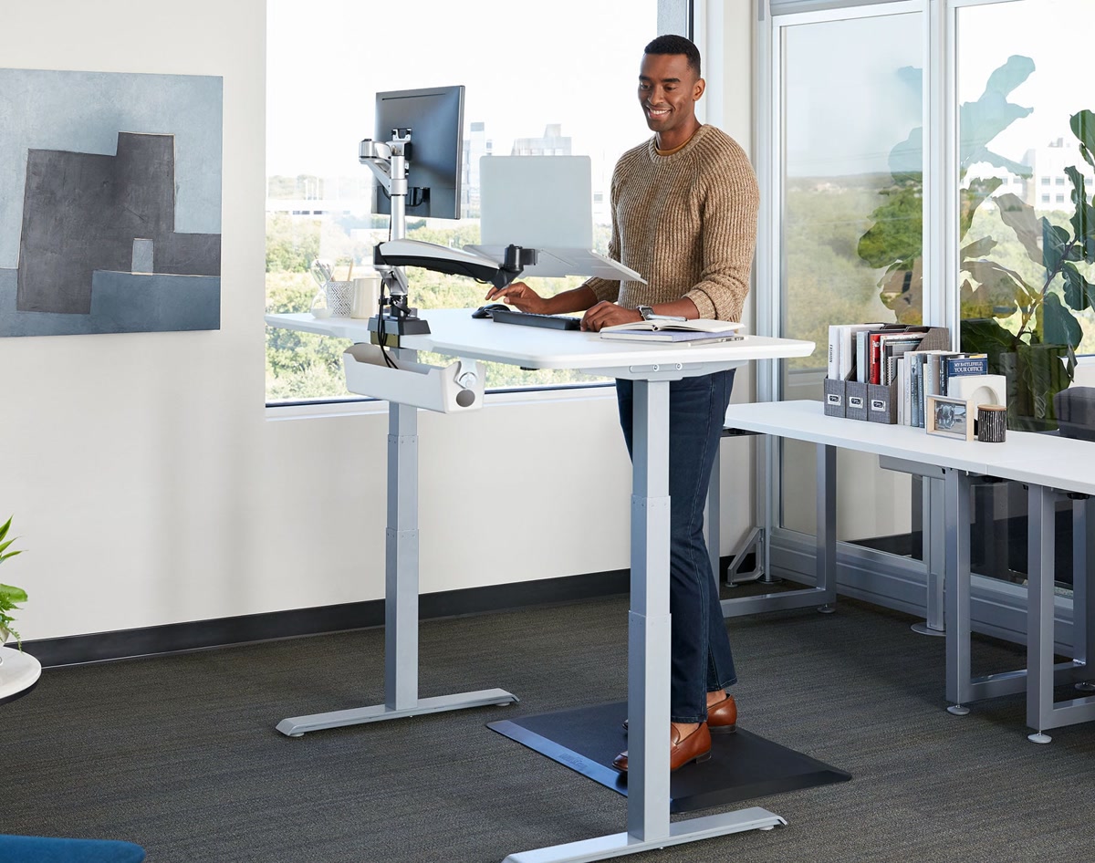 Modern home office desk with smart devices and computer setup