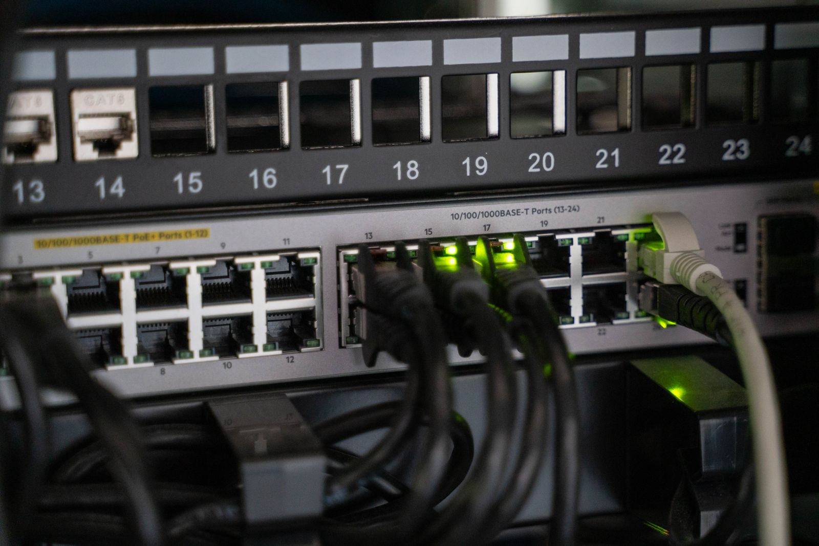 Network switch with ethernet cables connected in a home rack