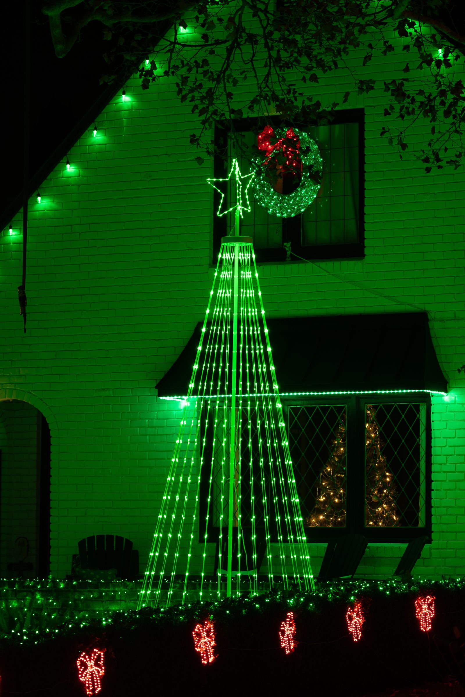 House decorated with Christmas lights at night