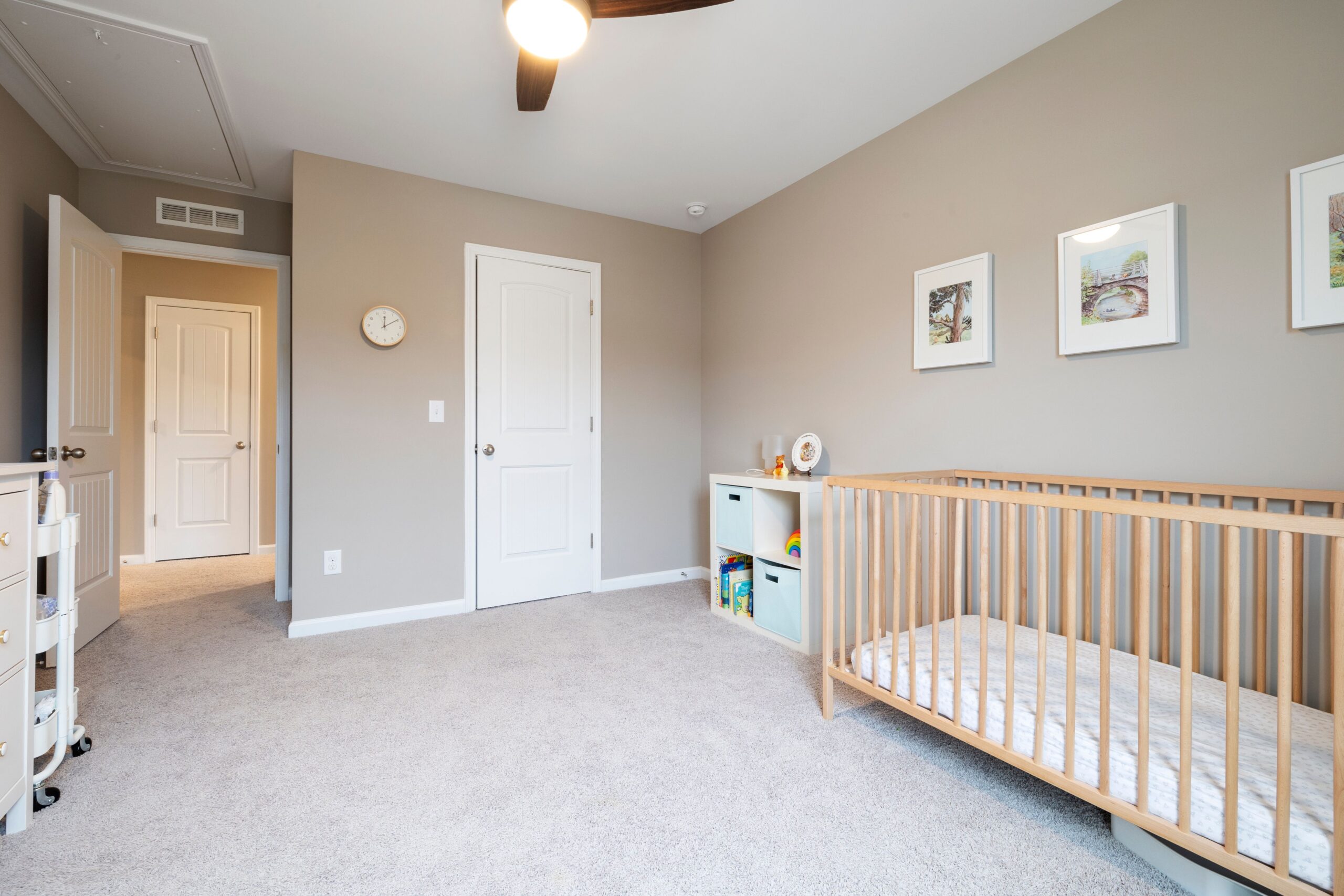 Bright nursery room with a wooden crib and modern decor