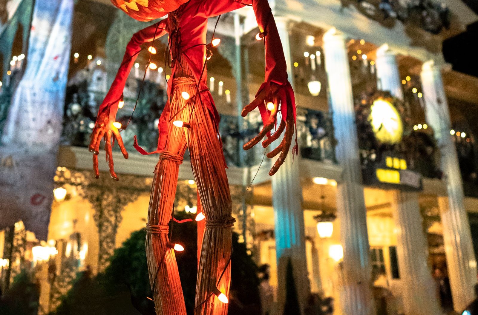 House and yard decorated for Halloween at night