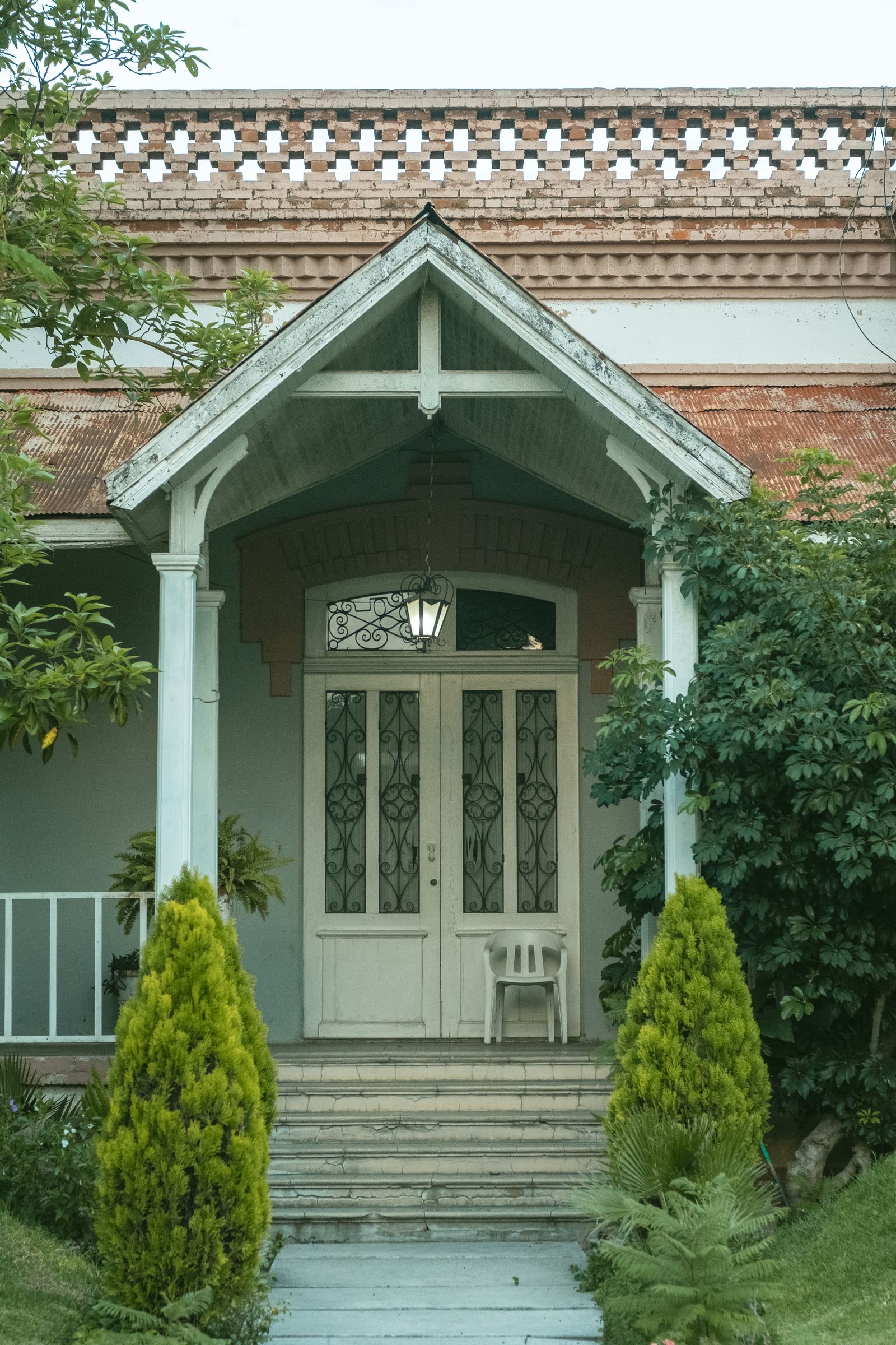Front-door entrance of a house — the exact spot where a doorbell name change costs you money
